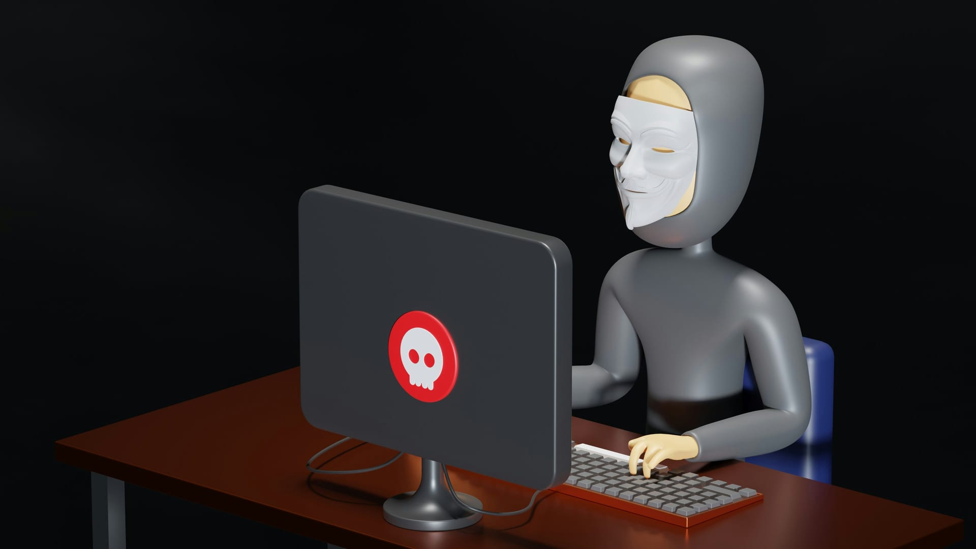 Una figura con máscara estilo Guy Fawkes teclea frente a una computadora cuya pantalla muestra un ícono de calavera roja, en un cuarto oscuro.