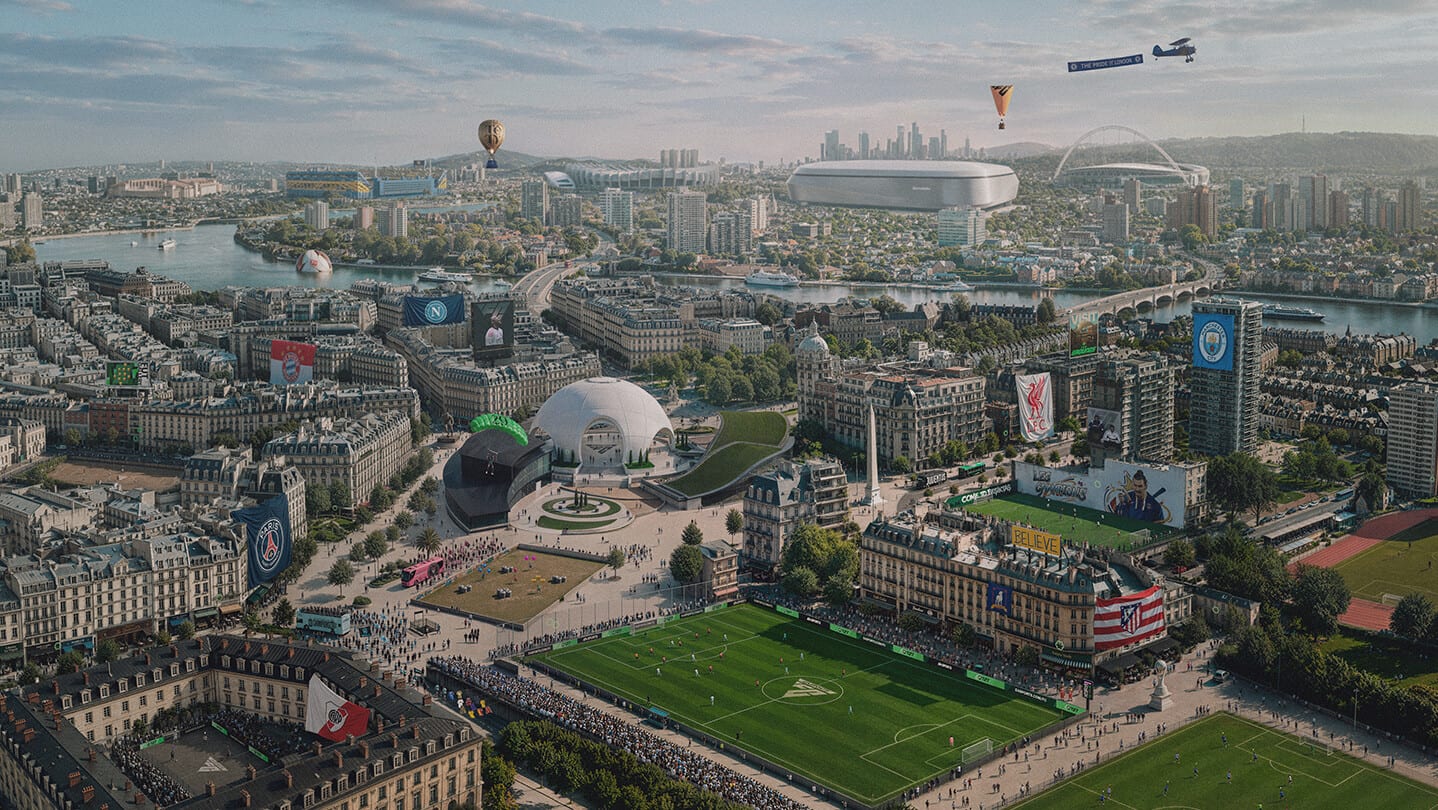 Vista aérea de una ciudad con una cancha de fútbol rodeada de estadios, edificios y globos aerostáticos en el cielo.