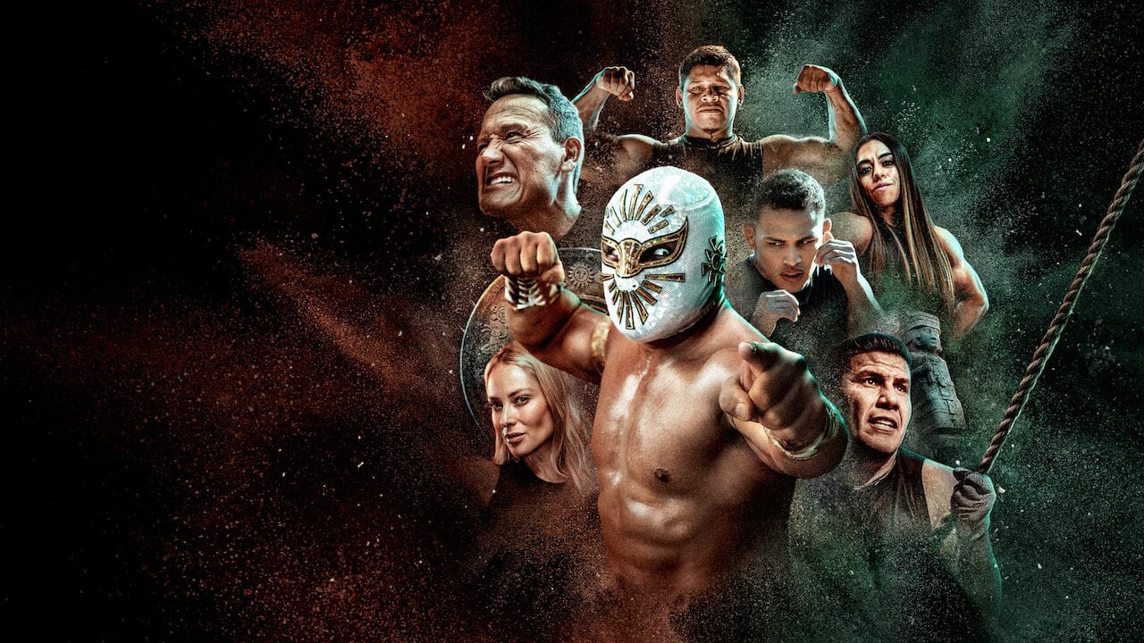 Arte promocional con varios competidores en pose de combate; al centro, un luchador enmascarado señala al frente con el puño en alto.